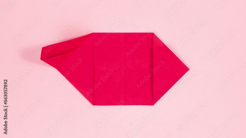 4k Red sheet of paper turns into three-dimensional origami heart. Pink background. Symbol of Greeting card. Concept of valentine's holiday, wedding and other occasions. Stop motion animation. 4k Red sheet of paper turns into three-dimensional origami heart. Pink background. Symbol of Greeting card. Concept of valentine's holiday, wedding and other occasions. Stop motion animation.