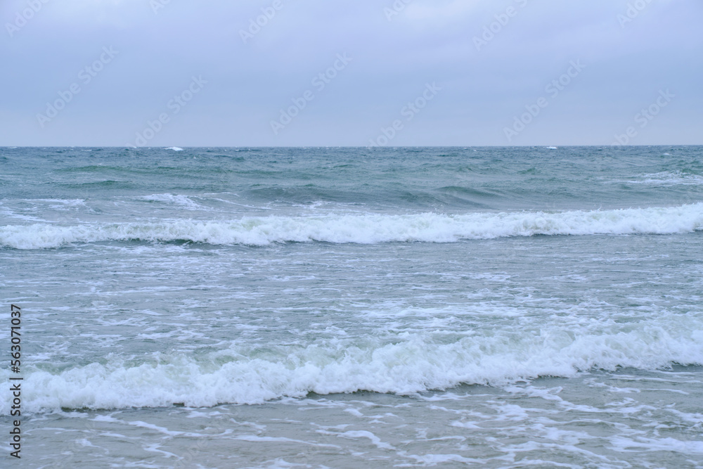 Rolling waves on sandy beach Baltic Sea. Rolling waves on sandy beach Baltic Sea.