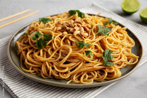 Homemade Asian Peanut Sauce Noodles on a Plate, side view.