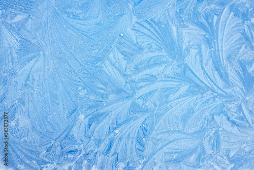 Picturesque ice pattern. Winter wonderland and Christmas magic concepts. Frozen water surface, glass or view from the window. Environment, nature, ecology, cold weather, climate change themes