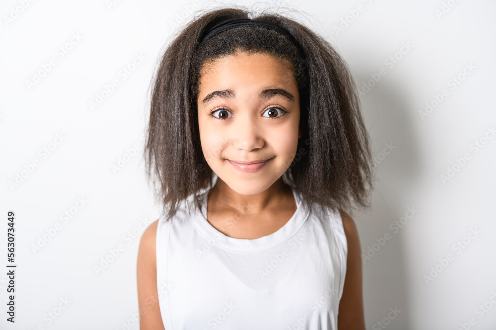 Adorable 9 years child girl on studio white background Adorable 9 years child girl on studio white background