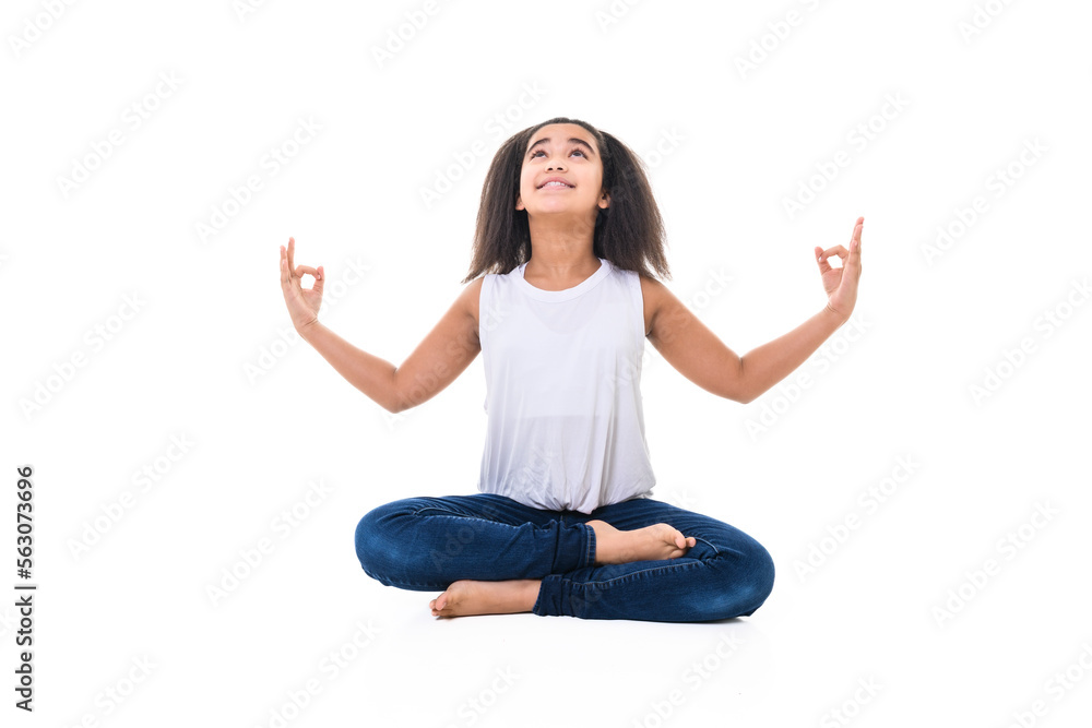 Adorable 9 years child girl on studio white background doing yoga Adorable 9 years child girl on studio white background doing yoga