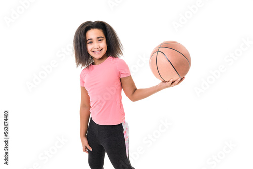 Studio shot of young girl, basketball player over white background