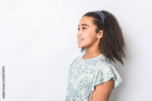 Adorable 9 years child girl on studio white background