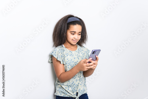 Adorable 9 years child girl on studio white background
