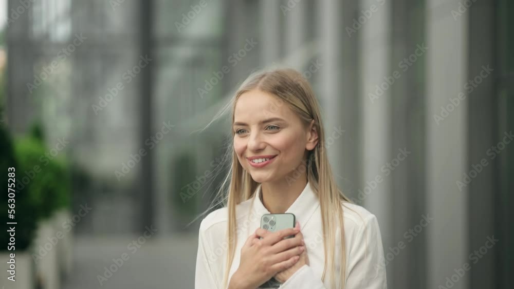 Closeup joyful girl reading good news on phone in slow motion. Portrait of happy business woman enjoy success on mobile phone. Surprised lady celebrating victory on phone Closeup joyful girl reading good news on phone in slow motion. Portrait of happy business woman enjoy success on mobile phone. Surprised lady celebrating victory on phone