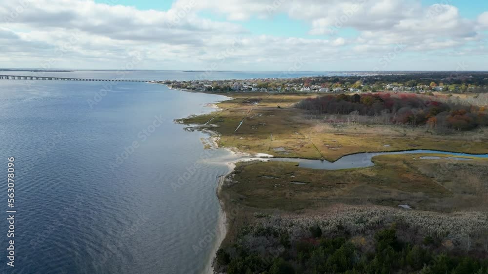 Drone moving over the south shore of Long Island looking West toward the Great South Bay bridge. Drone moving over the south shore of Long Island looking West toward the Great South Bay bridge.