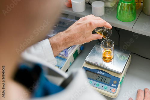 compounding pharmacist at work photo