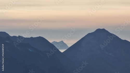beautiful foggy mountain range on Kvaløya at sunset, Tromsø, Norway