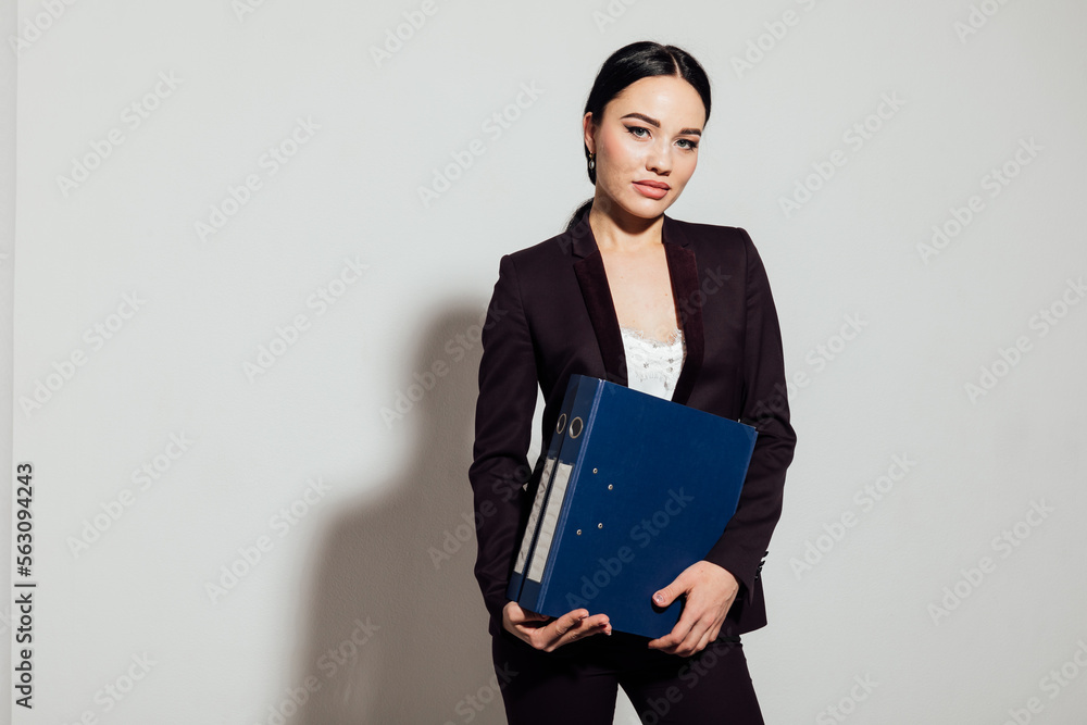 a business woman holds folders with documents in the office a business woman holds folders with documents in the office