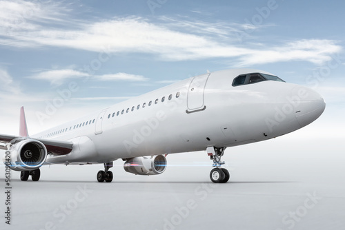 Close-up of passenger airplane isolated on bright background with sky