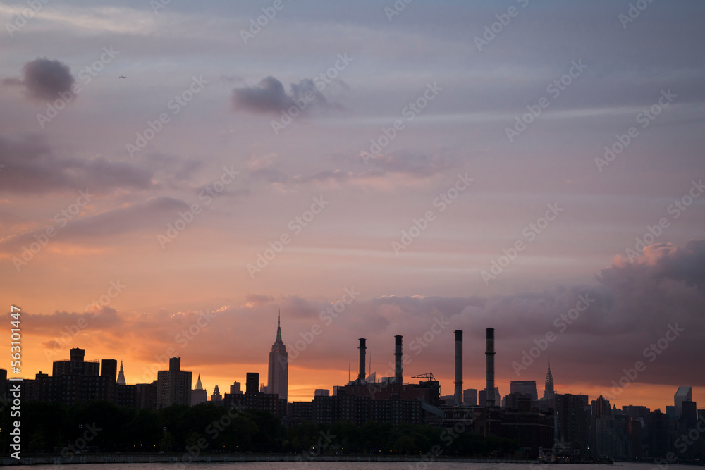 Sunset purple view of Manhattan skyline from the East River, New York