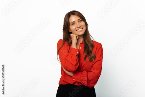 Modern young blonde woman wearing red shirt is wide smiling at the camera over white background.