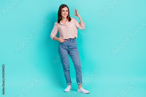 Full length photo of sweet shiny lady wear pink shirt smiling showing okey gesture isolated turquoise color background