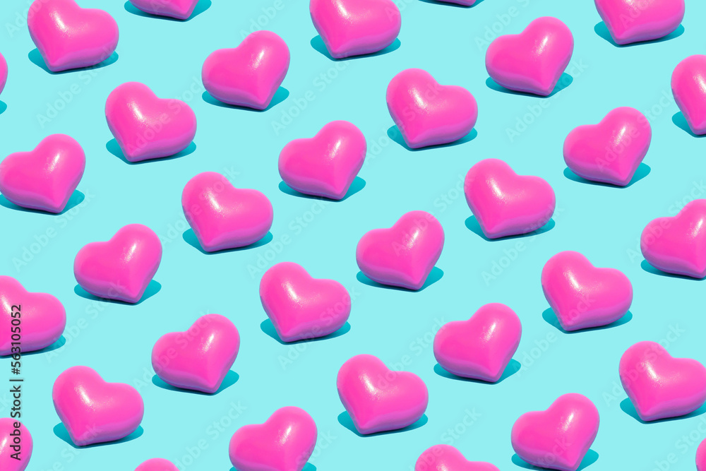 Minimal love, Valentine's Day idea. Seamless pattern of vivid pink hearts on pastel blue background. Minimal love, Valentine's Day idea. Seamless pattern of vivid pink hearts on pastel blue background.