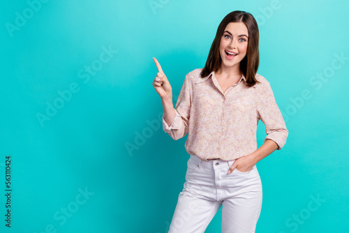 Photo of attractive young girl excited hand hold pocket point empty space wear trendy smart casual look isolated on cyan color background
