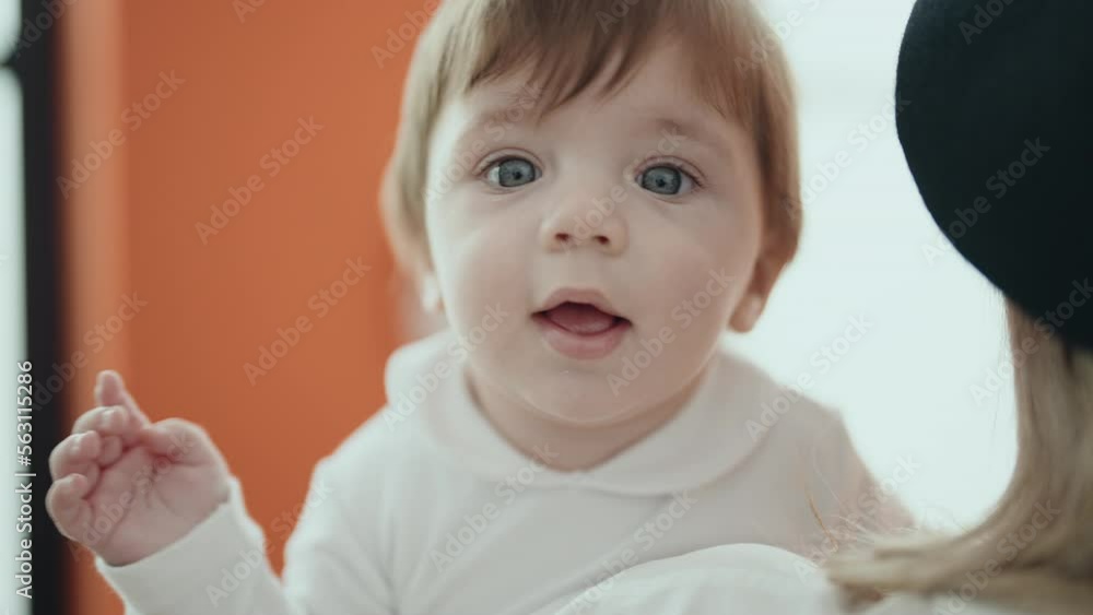 Adorable hispanic toddler smiling confident lying on bed at home Adorable hispanic toddler smiling confident lying on bed at home