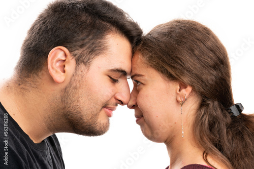 Close-up of cute male and female couple faces together