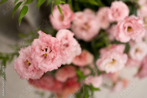 Main table at a wedding reception with beautiful fresh flowers and candles.