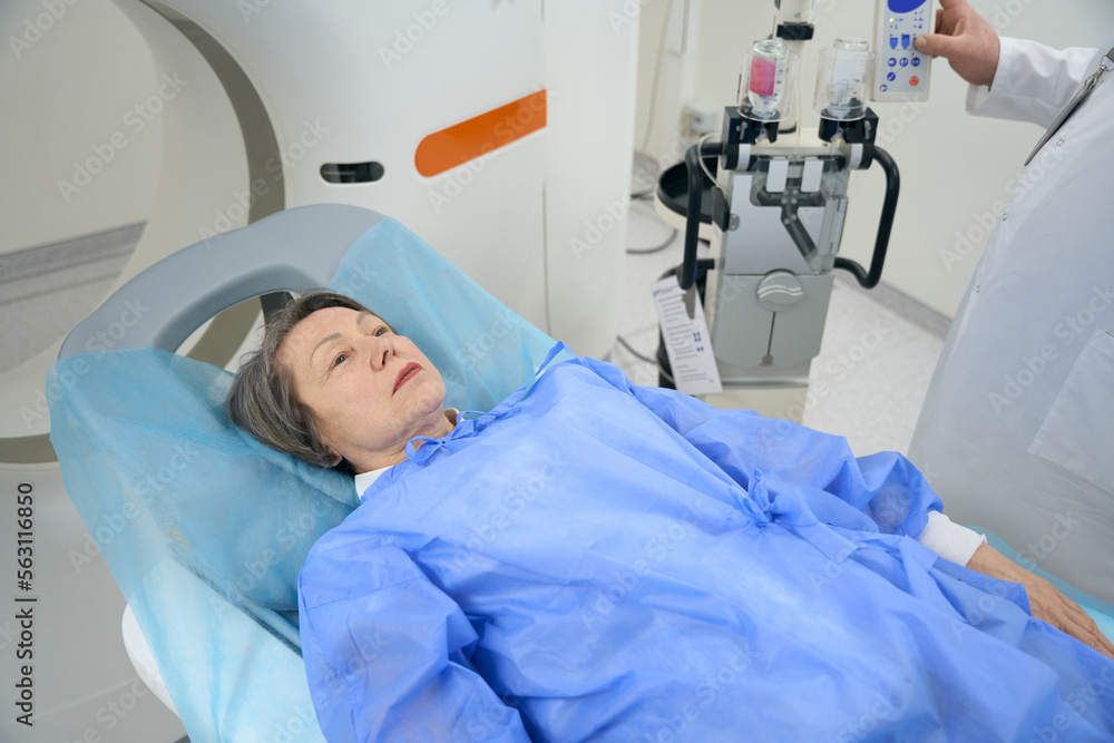 Doctor sends the patient to the CT camera Doctor sends the patient to the CT camera