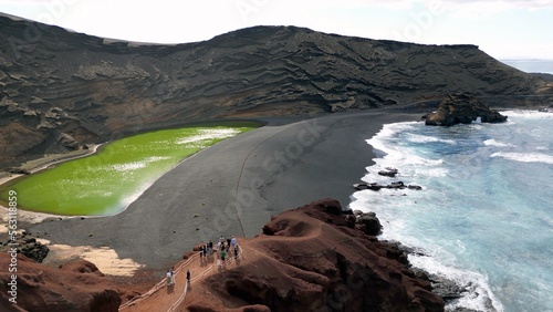 Europe, Spain, Lanzarote, Canary Islands - Charco de Los Clicos (Charco Verde) drone aerial view of green lagoon in Tymanfaya national park, Volcanic landscape - tourist attraction in biosfere reserve photo