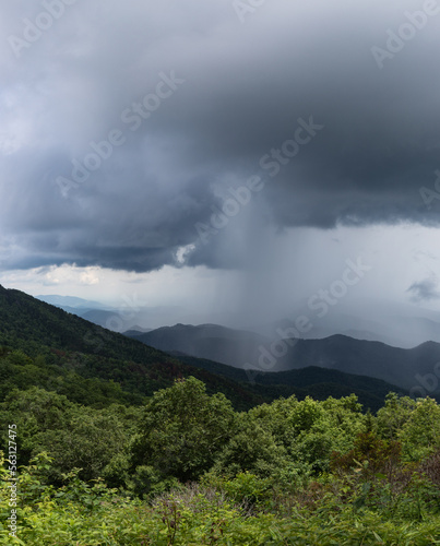 Tall panorama of an isolated cloudburst of rain  weather event with cloud copy space  vertical aspect
