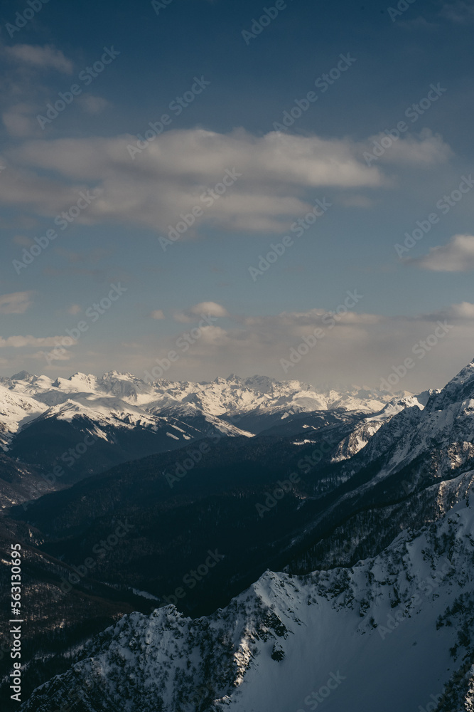 Snowy mountains. Sunny winter day. Amazing snow covered peaks in the Sochi, Russia.