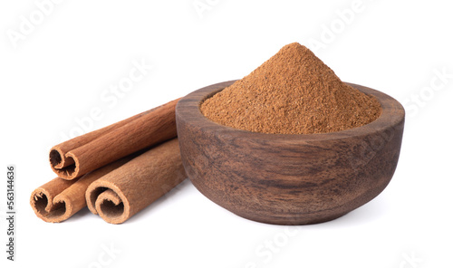 Cinnamon spice. Cinnamon sticks. Cinnamon powder in a wooden bowl.