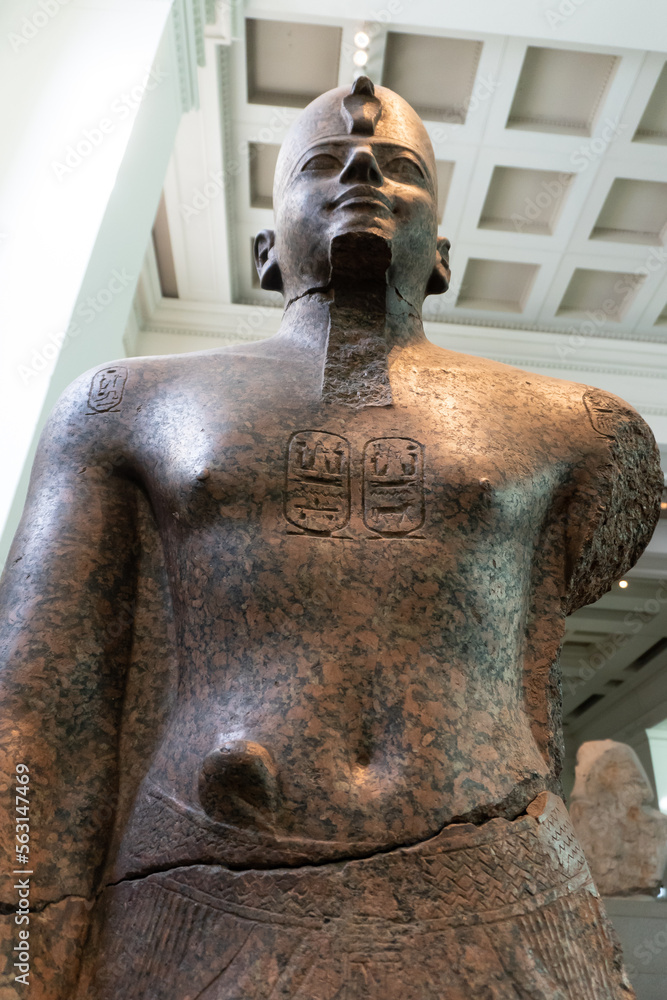 The British Museum in London. Egyptian Gallery. Red granite figure of