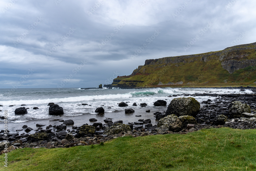 Giant's Causeway, area of interlocking basalt columns in Northern Ireland. Result of an ancient volcanic fissure eruption. The Causeway Coast natural wonder is managed by the National Trust.