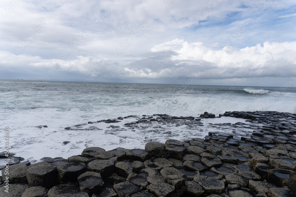 Giant's Causeway, area of interlocking basalt columns in Northern Ireland. Result of an ancient volcanic fissure eruption. The Causeway Coast natural wonder is managed by the National Trust.