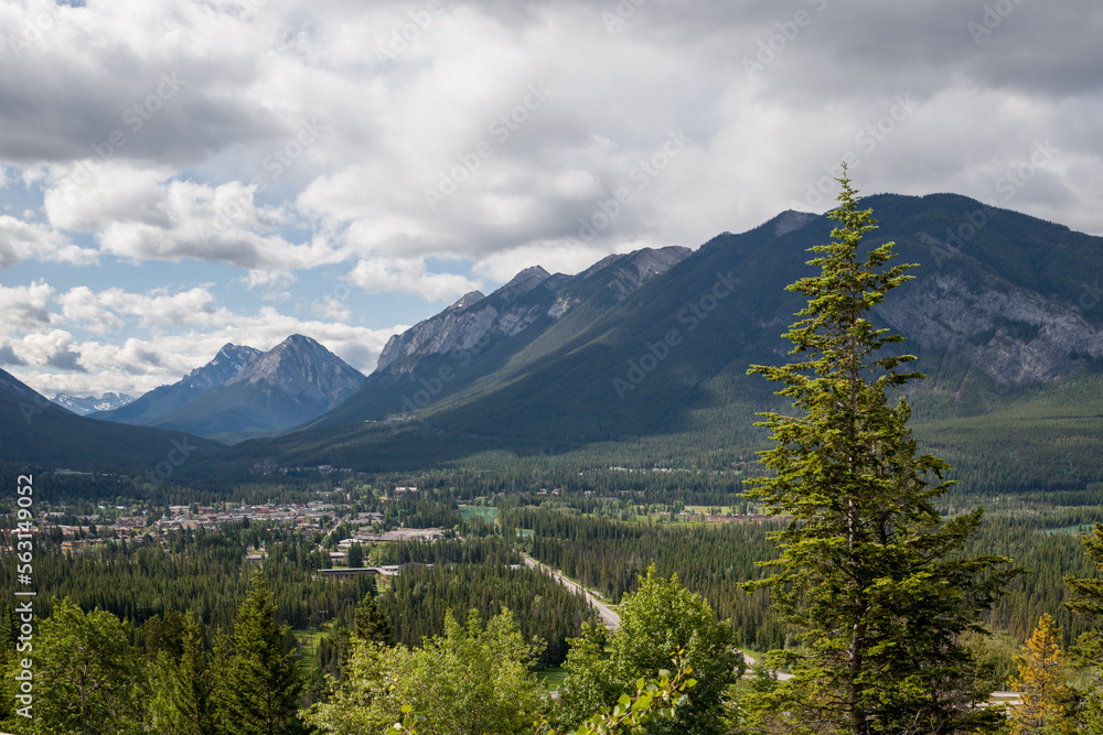 Obraz premium Beautiful aerial view of Rocky Mountains and river. Banff city in the valley. Alberta. Tourism - active recreation in nature
