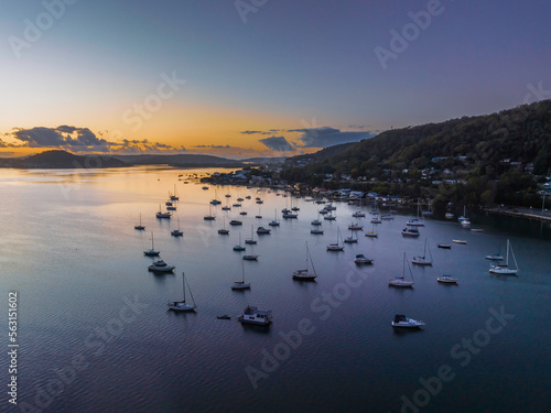 Aerial sunrise waterscape over the bay with boats photo