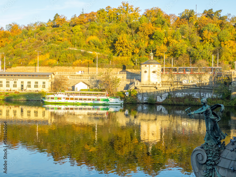 Fototapeta premium Colors of autumn Prague. Picturesque autumn colors on the embankment by the Vltava river, Prague, Czech Republic