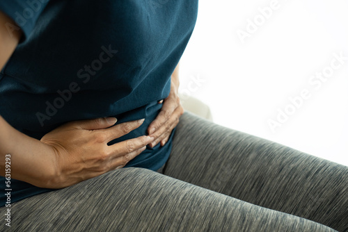 close up woman has stomachache or menstrual on white background, medicine and healthy concept