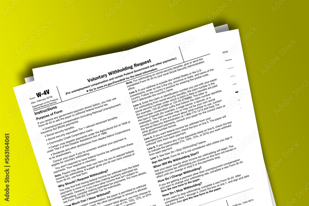 Form W-4V documentation published IRS USA 43436. American tax document on colored Form W-4V documentation published IRS USA 43436. American tax document on colored