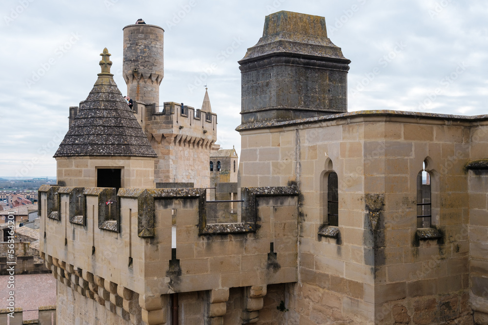 View of the historic town of Olite in Navarra, Spain, with a castle visited by tourists.