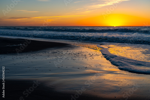 Ocean Sunrise with Reflections on Wet Sand (Sun to Right)