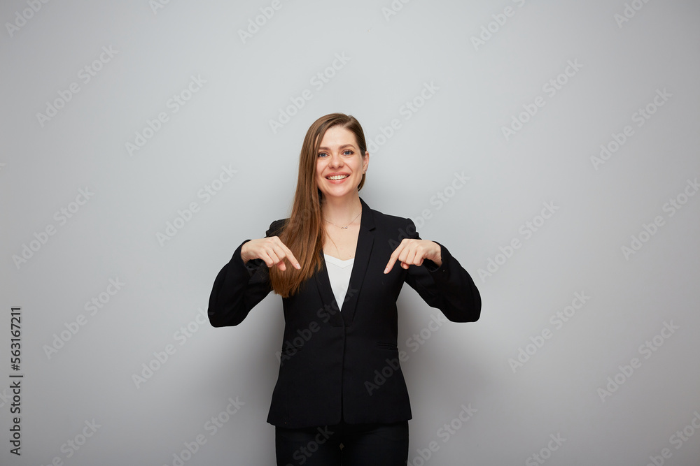 Business woman pointing finger down at copy space. Business woman pointing finger down at copy space.