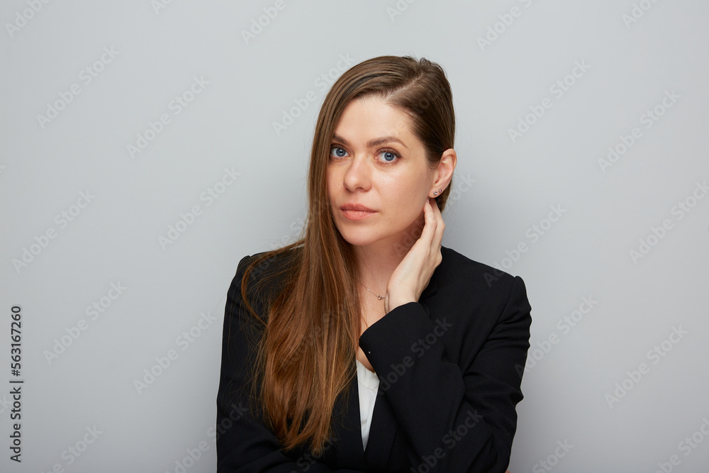 Serious young business woman touching her face Isolated portrait. Serious young business woman touching her face Isolated portrait.