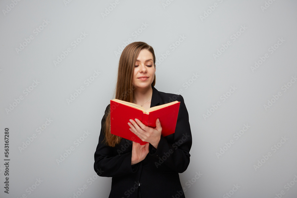 Portrait of smiling girl student or woman teacher reading book. Portrait of smiling girl student or woman teacher reading book.