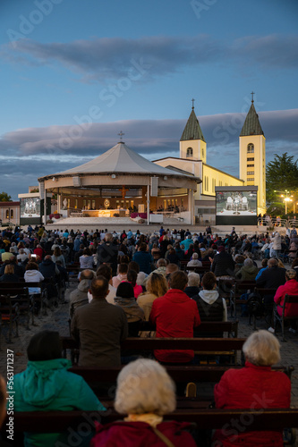 Pilgrims adoring Jesus Christ present in the Blessed Sacrament after the evening Holy Mass in Medjugorje, Bosnia and Herzegovina. 2022/09/27.