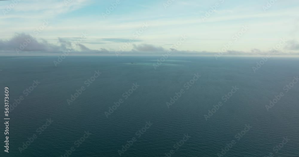 Surface of blue ocean with waves and blue sky with cloud, aerial view. Water cloud horizon background. Surface of blue ocean with waves and blue sky with cloud, aerial view. Water cloud horizon background.