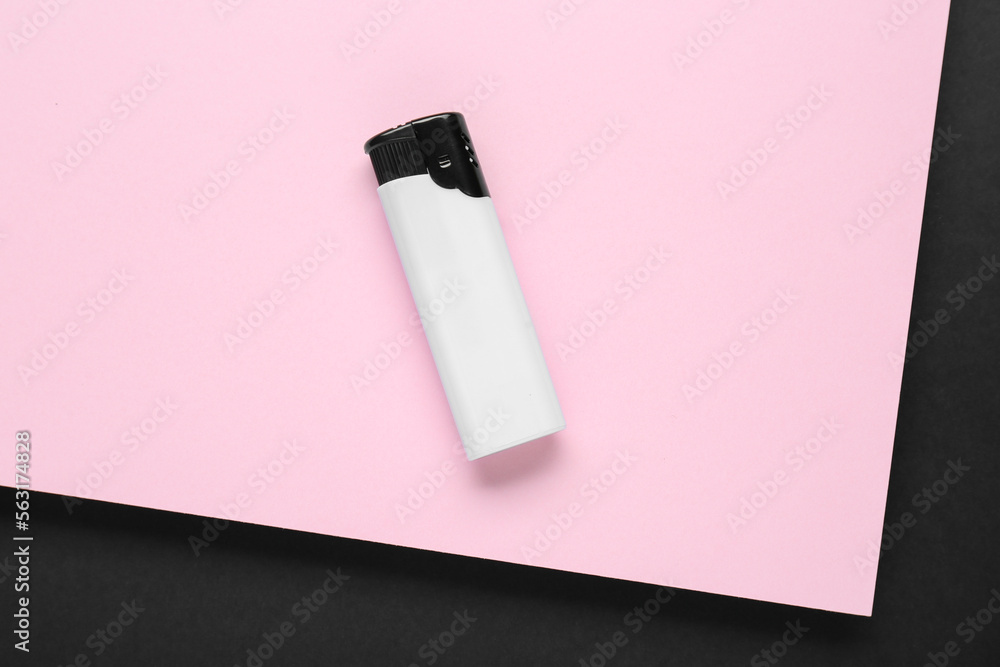 Stylish small pocket lighter on color background, top view Stylish small pocket lighter on color background, top view