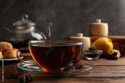 Aromatic tea with anise stars on wooden table