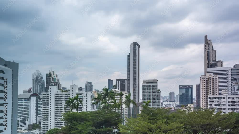 Time lapse view of Bangkok high-rises on cloudy day with white clouds moving across the sky Time lapse view of Bangkok high-rises on cloudy day with white clouds moving across the sky