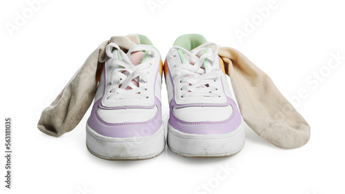 Dirty socks and sneakers on white background