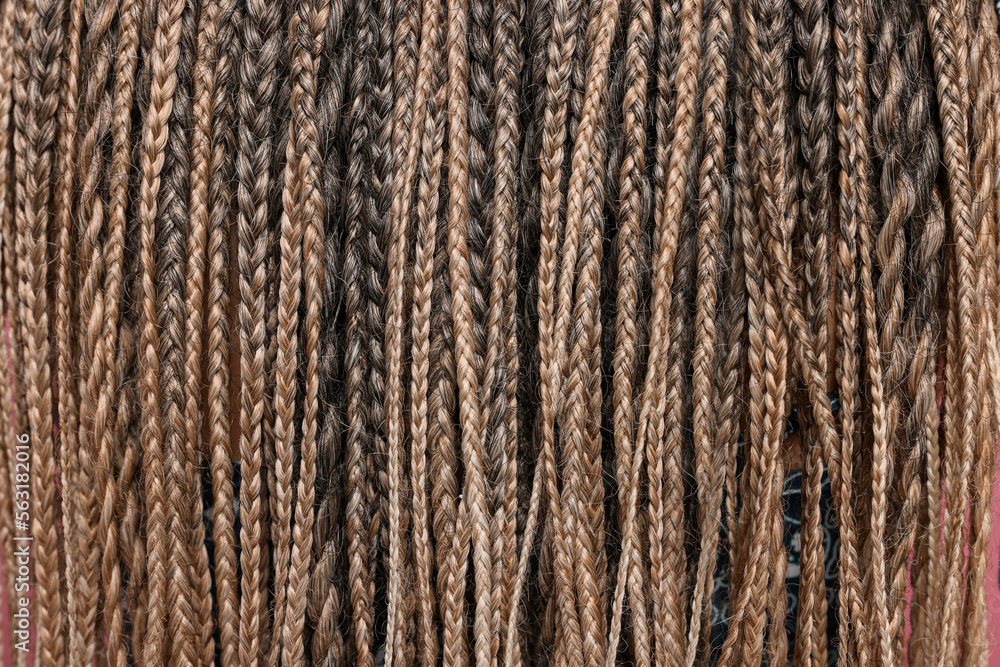 Many african braids as background, closeup view Many african braids as background, closeup view