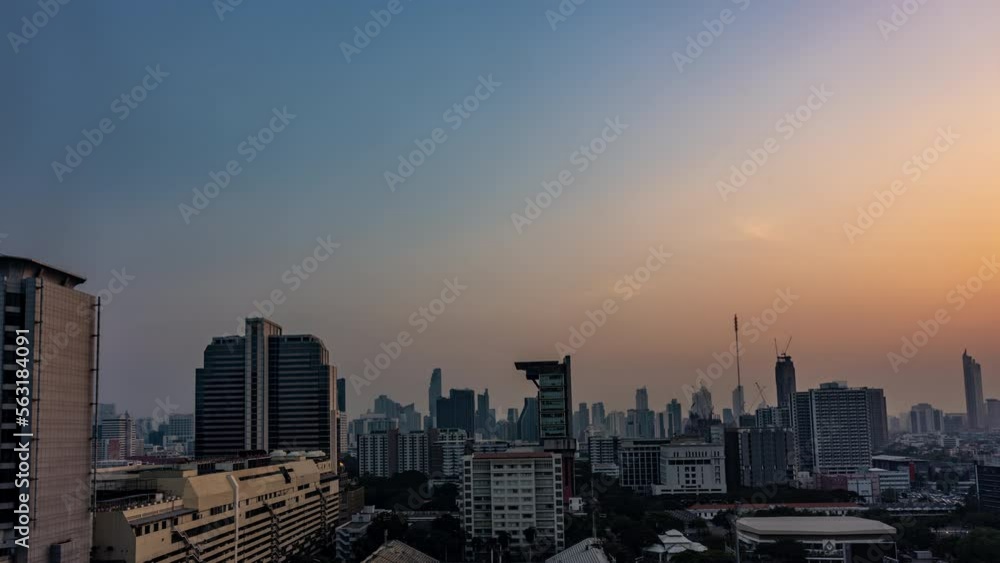 Bangkok, Thailand - 13 January 2023 - Time lapse view of Bangkok high-rises during sunset with moving clouds in the sky Bangkok, Thailand - 13 January 2023 - Time lapse view of Bangkok high-rises during sunset with moving clouds in the sky