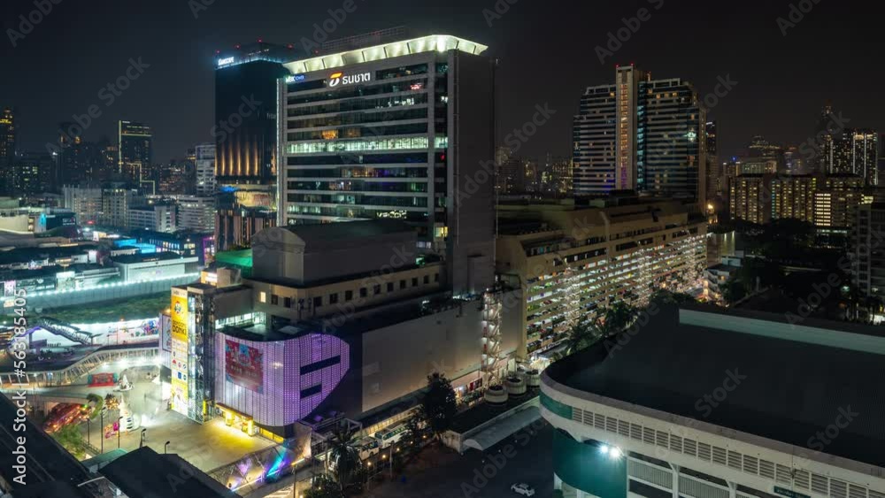 Time lapse view of Bangkok high-rises at night with moving clouds in the sky Time lapse view of Bangkok high-rises at night with moving clouds in the sky